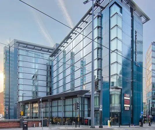 Luxury hotel with airport shuttle bus outside Manchester Airport terminal